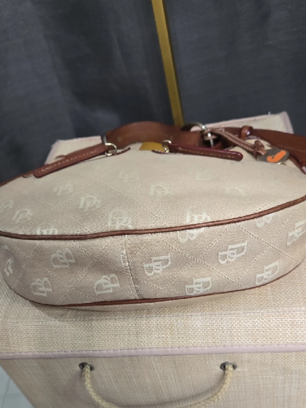 EUC Dooney & Bourke Beige and Brown Crescent Hobo with Orange Logo Charm